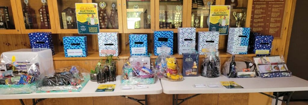 Silent auction table showing items available
